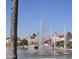 Beautiful lake view featuring lovely houses and tall spraying fountains creating a serene and upscale neighborhood at 3828 N Rosewood Ave, Avondale, AZ 85392