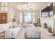 Spacious living room with a large window, fireplace, and comfortable seating for relaxation at 3828 N Rosewood Ave, Avondale, AZ 85392