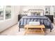 Well-lit main bedroom featuring large windows and carpet flooring at 3828 N Rosewood Ave, Avondale, AZ 85392