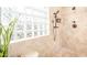 Tiled shower with glass block window at 3828 N Rosewood Ave, Avondale, AZ 85392