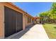 A spacious covered patio extends to a grassy backyard oasis, perfect for outdoor entertaining at 408 W Stacey Ln, Tempe, AZ 85284