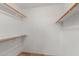 Walk-in closet with built in shelving and storage space at 408 W Stacey Ln, Tempe, AZ 85284
