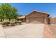 Single-story home featuring a spacious driveway, manicured landscaping, and a neutral-toned facade at 408 W Stacey Ln, Tempe, AZ 85284