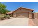 Lovely home featuring a spacious driveway, beautiful landscaping, and a well-maintained exterior at 408 W Stacey Ln, Tempe, AZ 85284