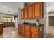 View of the kitchen featuring granite countertops and wooden cabinetry at 408 W Stacey Ln, Tempe, AZ 85284