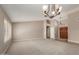 Spacious living area features neutral walls, carpet, and a large window letting in natural light at 408 W Stacey Ln, Tempe, AZ 85284