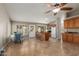Open-concept living area with tile flooring, kitchen bar, and dining table, perfect for modern living at 408 W Stacey Ln, Tempe, AZ 85284