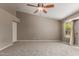 The main bedroom has carpet flooring, a ceiling fan, and a window at 408 W Stacey Ln, Tempe, AZ 85284