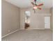 Spacious main bedroom with a ceiling fan, carpet flooring and an ensuite bathroom with a soaking tub at 408 W Stacey Ln, Tempe, AZ 85284