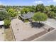 Aerial view of a well-maintained property with mature trees, desert landscaping, a three-car garage and ample parking at 4212 W Tierra Buena Ln, Phoenix, AZ 85053