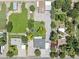 Aerial view showcasing the property's layout, including the house, outbuildings, and landscaping at 4212 W Tierra Buena Ln, Phoenix, AZ 85053