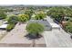 Expansive aerial view of home with large gravel front yard and mature trees and long driveway at 4212 W Tierra Buena Ln, Phoenix, AZ 85053