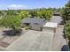 Spacious residential property featuring mature trees, desert landscaping and a large driveway with three-car garage at 4212 W Tierra Buena Ln, Phoenix, AZ 85053