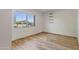 This bedroom has bright sunlight and wood-look tile flooring at 4212 W Tierra Buena Ln, Phoenix, AZ 85053
