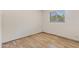 Minimalist bedroom with tile floors and a window offering natural light, suitable for various decor styles at 4212 W Tierra Buena Ln, Phoenix, AZ 85053