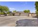 Spacious three-car garage with stone accents and a wide driveway at 4212 W Tierra Buena Ln, Phoenix, AZ 85053