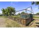 Fenced garden area with wooden planters and a frame for climbing plants at 4212 W Tierra Buena Ln, Phoenix, AZ 85053