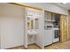 This laundry room features a sink, storage, and washer/dryer at 4212 W Tierra Buena Ln, Phoenix, AZ 85053