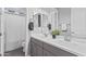 Well-lit bathroom featuring double sinks, modern fixtures and a shower and bath combination at 4302 E Cynthia St, Gilbert, AZ 85295