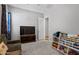 Open bedroom including carpet, a TV, and a bookshelf for toys and books at 4302 E Cynthia St, Gilbert, AZ 85295