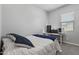 Neutral bedroom featuring plush carpeting, a large window and space for a work area at 4302 E Cynthia St, Gilbert, AZ 85295