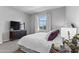 A well-lit bedroom with a view to the exterior at 4302 E Cynthia St, Gilbert, AZ 85295