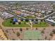 Aerial view of a community park with basketball court, green space, and shaded seating areas at 4302 E Cynthia St, Gilbert, AZ 85295