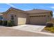Exterior view of home with a two-car garage, desert landscaping and a tile roof at 4302 E Cynthia St, Gilbert, AZ 85295