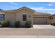Exterior view of home including a two-car garage and desert landscaping at 4302 E Cynthia St, Gilbert, AZ 85295