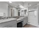 The main bathroom features double sinks, granite countertops, and a walk-in shower at 4302 E Cynthia St, Gilbert, AZ 85295
