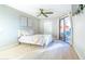 Bright bedroom with sliding glass door and neutral decor at 4303 E Cactus Rd # 128, Phoenix, AZ 85032
