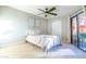 Serene bedroom with neutral walls, plush bedding, and a sliding glass door to the outside at 4303 E Cactus Rd # 128, Phoenix, AZ 85032