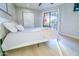 This bright bedroom features a sliding glass door and ample natural light at 4303 E Cactus Rd # 128, Phoenix, AZ 85032