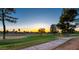 Scenic golf course view with mature trees at sunset at 4303 E Cactus Rd # 128, Phoenix, AZ 85032