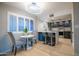 Well-lit kitchen nook with breakfast table, bar seating, stainless steel appliances, and bright counters at 4303 E Cactus Rd # 128, Phoenix, AZ 85032
