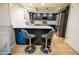 Stylish kitchen with black cabinets, stainless steel appliances, and a quartz countertop at 4303 E Cactus Rd # 128, Phoenix, AZ 85032