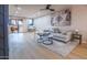 Bright living room with sliding glass doors and comfortable seating area at 4303 E Cactus Rd # 128, Phoenix, AZ 85032