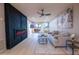 Modern living room with fireplace, stylish decor, and sliding glass doors at 4303 E Cactus Rd # 128, Phoenix, AZ 85032