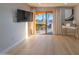 Bright living room with sliding glass doors leading to the patio offering a picturesque waterfront view at 4303 E Cactus Rd # 128, Phoenix, AZ 85032