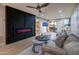 This living room features a modern fireplace, fan, and stylish decor at 4303 E Cactus Rd # 128, Phoenix, AZ 85032