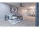 Cozy living room featuring comfortable seating, stylish decor, and dining area at 4303 E Cactus Rd # 128, Phoenix, AZ 85032
