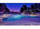 Outdoor pool featuring illuminated water, deck chairs, lounge area, and shaded area. Great for relaxing at 4303 E Cactus Rd # 128, Phoenix, AZ 85032