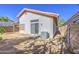 The backyard features a concrete patio, AC unit, and minimal landscaping at 522 W Dennis Ct, Tempe, AZ 85283