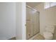 Bathroom featuring a shower with sliding glass doors and toilet at 522 W Dennis Ct, Tempe, AZ 85283