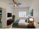 Bright bedroom featuring a ceiling fan, modern furniture, and a cozy rug at 522 W Dennis Ct, Tempe, AZ 85283