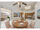 Charming dining area with a wood table and access to the outside patio at 522 W Dennis Ct, Tempe, AZ 85283
