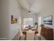 Bright dining room featuring modern furnishings, a vaulted ceiling, and sliding glass door at 522 W Dennis Ct, Tempe, AZ 85283