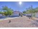 Charming single-story home featuring a low-maintenance yard, desert landscaping and a two-car garage at 522 W Dennis Ct, Tempe, AZ 85283
