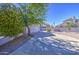Charming single-story home with desert landscaping, mature trees, and a two car garage at 522 W Dennis Ct, Tempe, AZ 85283