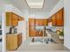 Spacious kitchen featuring tile floors, wood cabinets, and stainless steel faucet at 522 W Dennis Ct, Tempe, AZ 85283